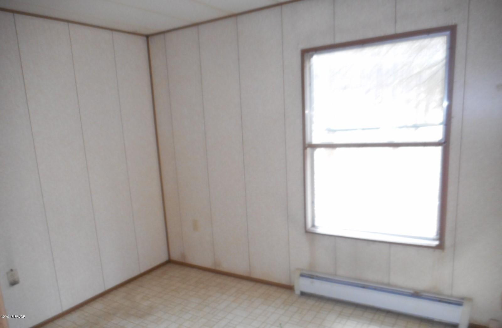 544 Hummingbird Lane Hawley, PA 18428 - Photo 13 of 16 a view of a window in an empty room