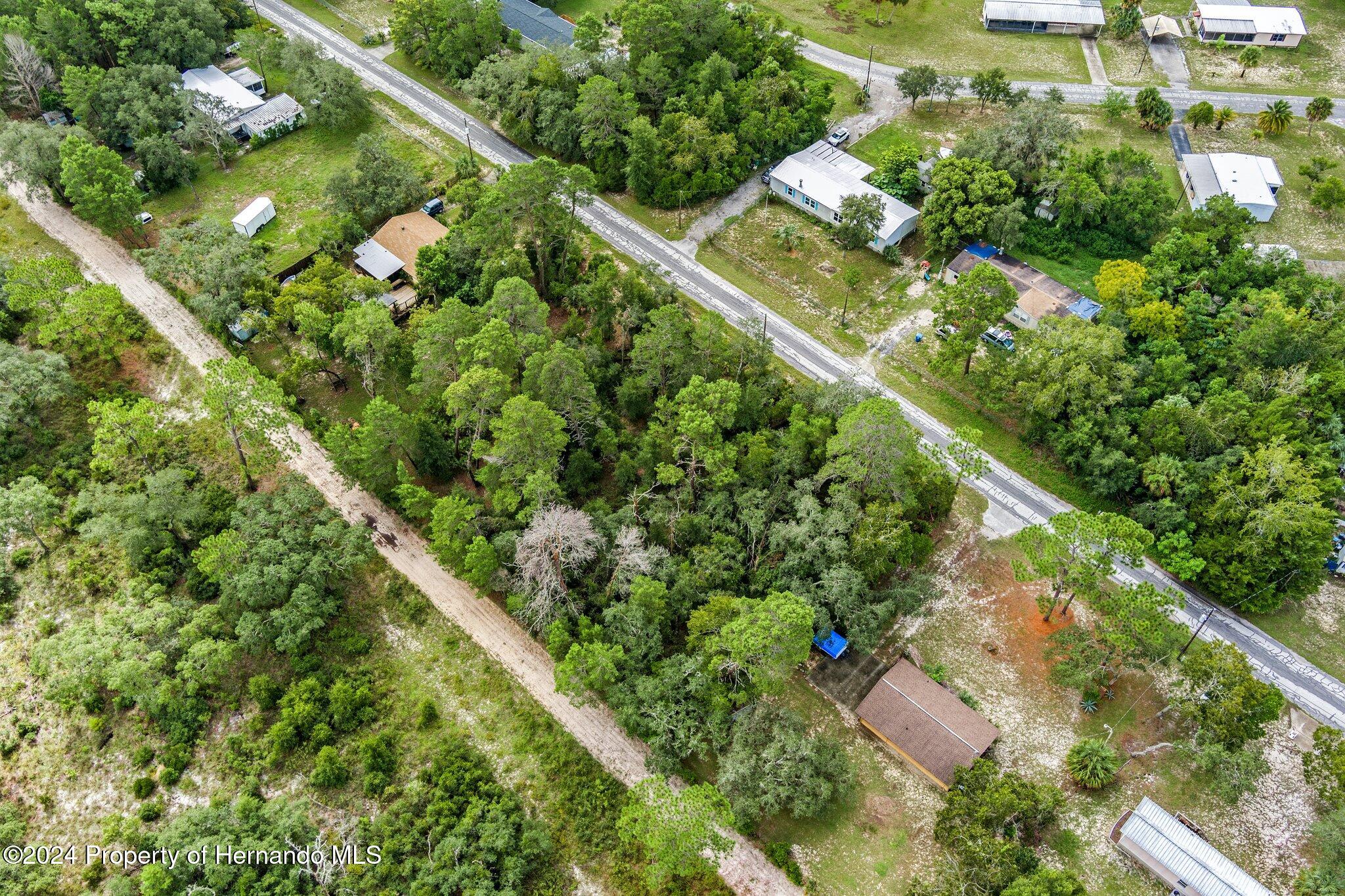 8055 Filson Street Weeki Wachee, FL 34613 - Photo 15 of 30 an aerial view of residential houses with outdoor space and trees