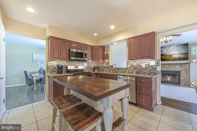 a kitchen with a stove a sink and a microwave
