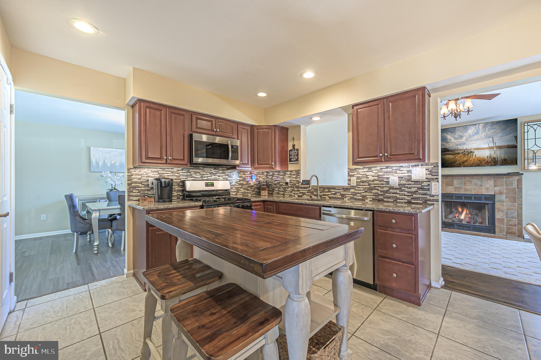 12 Persimmon Street Sicklerville, NJ 08081 - Photo 12 of 33 a kitchen with a stove a sink and a microwave