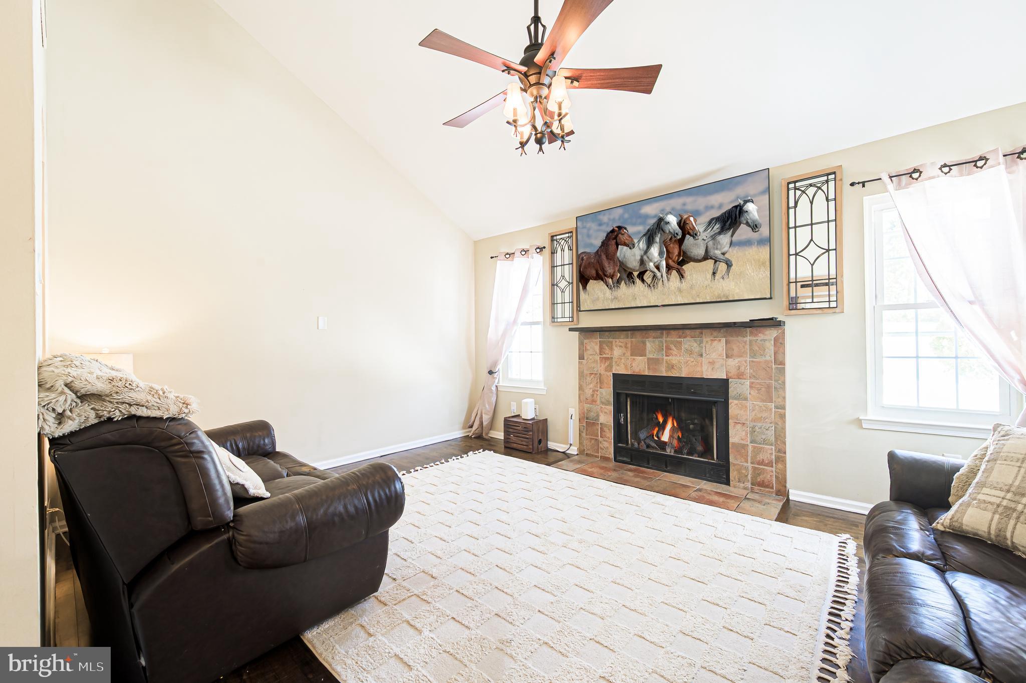12 Persimmon Street Sicklerville, NJ 08081 - Photo 16 of 33 a living room with furniture and a fireplace