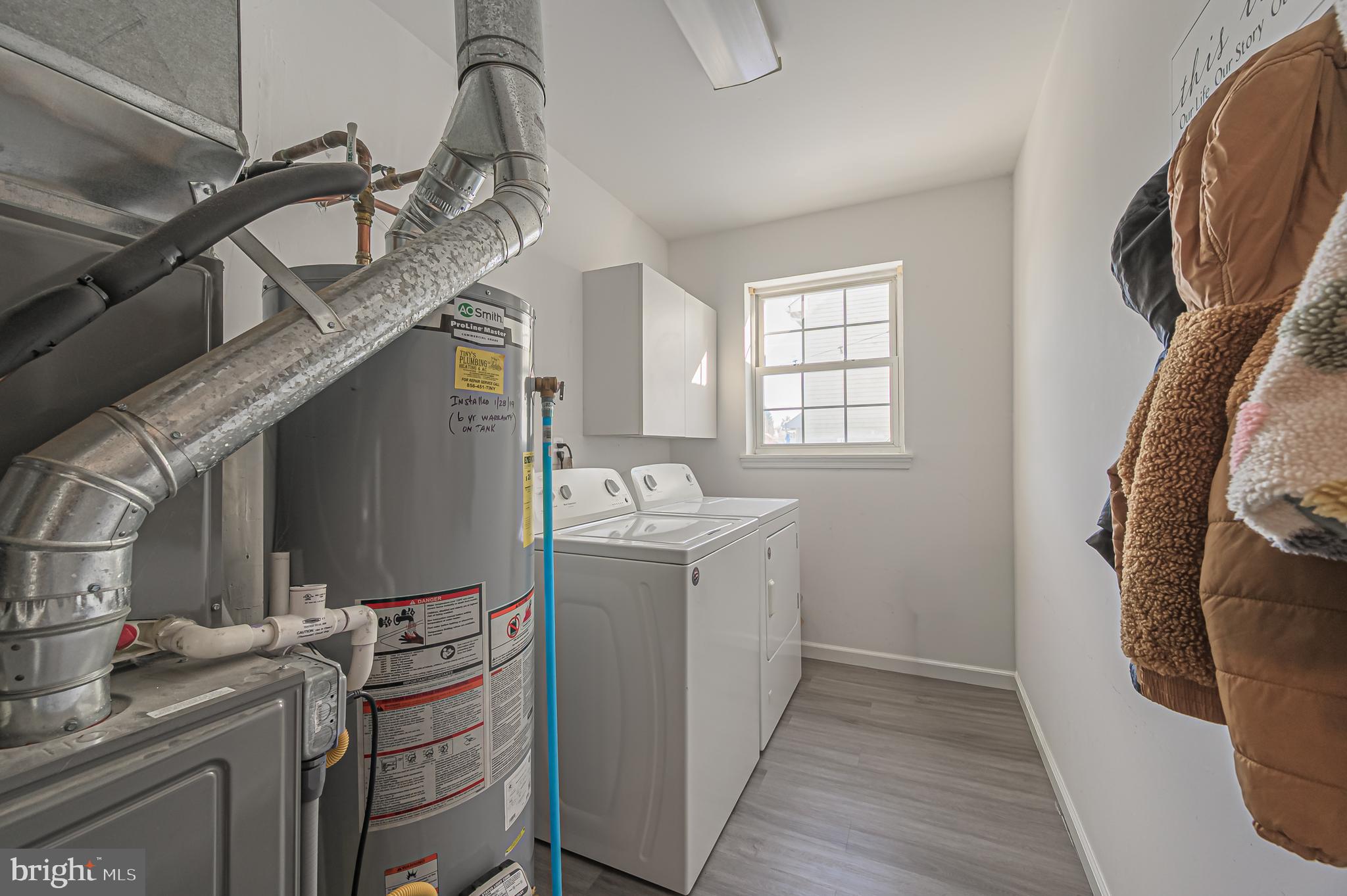 12 Persimmon Street Sicklerville, NJ 08081 - Photo 20 of 33 a room with cabinets a washer and dryer