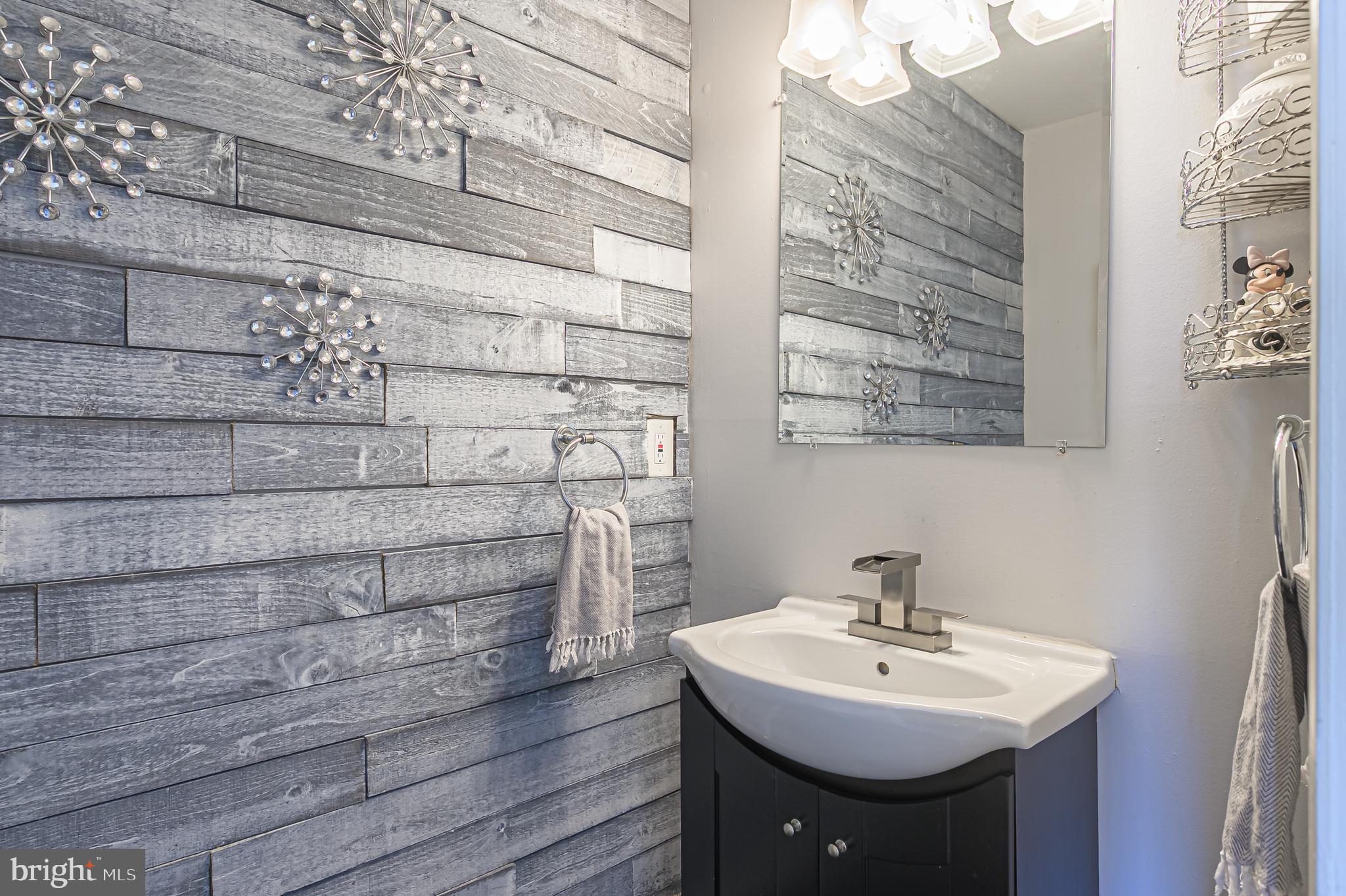 12 Persimmon Street Sicklerville, NJ 08081 - Photo 22 of 33 a bathroom with a sink and a mirror
