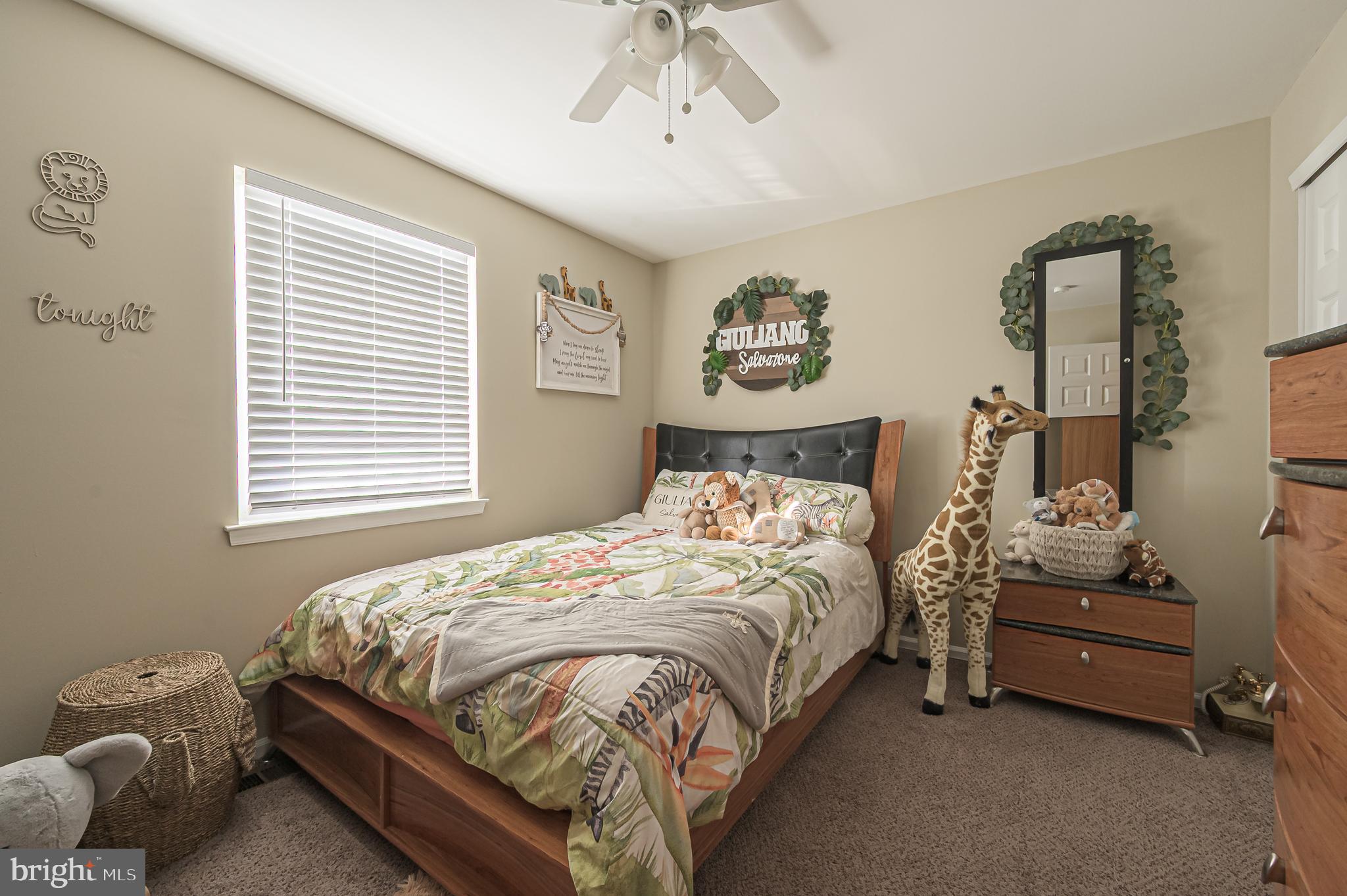 12 Persimmon Street Sicklerville, NJ 08081 - Photo 30 of 33 a bedroom with a bed and a chandelier