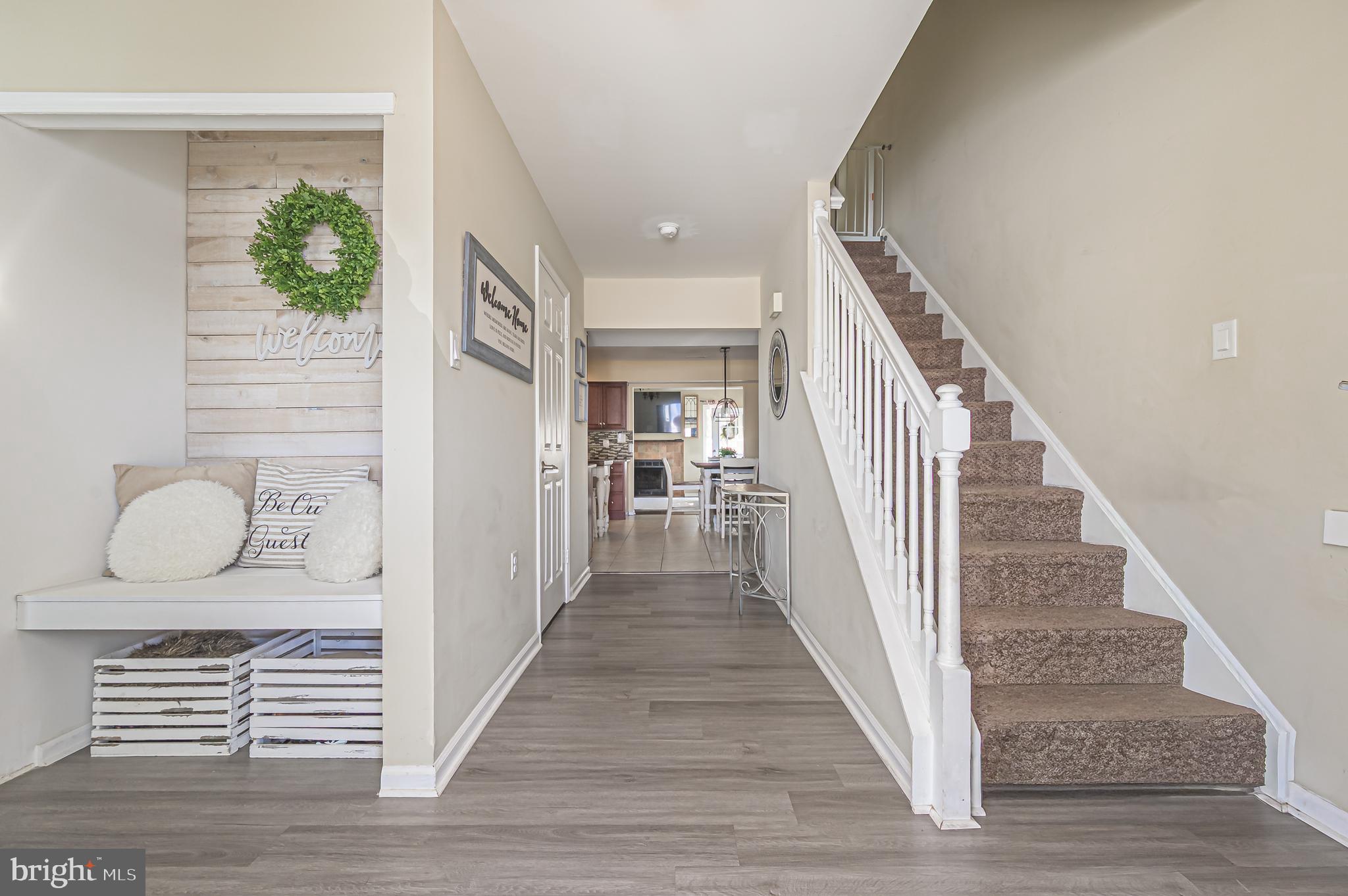 12 Persimmon Street Sicklerville, NJ 08081 - Photo 3 of 33 a view of a hallway with wooden floor and stairs
