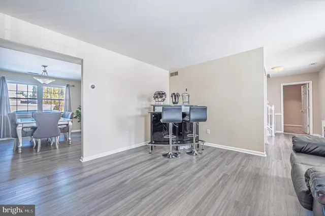 a view of a livingroom with furniture and a workspace