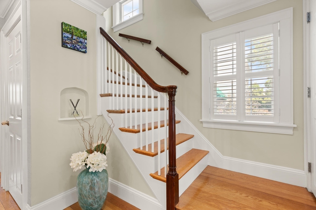89 Dwinell Street Boston, MA 02132 - Photo 6 of 37 a view of entryway with wooden floor and a front door