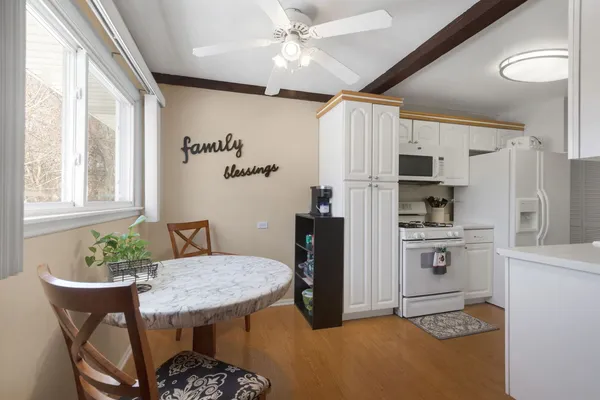 a kitchen with stainless steel appliances granite countertop a stove refrigerator and microwave