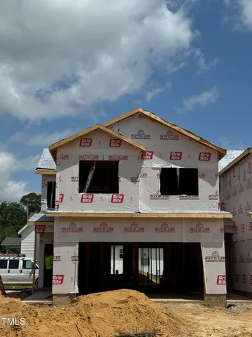 a view of house with roof deck