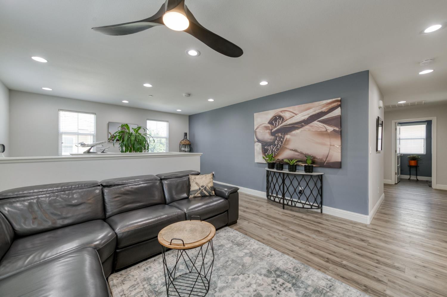 3562 Luminary Way Clovis, CA 93619 - Photo 22 of 40 a living room with furniture and wooden floor
