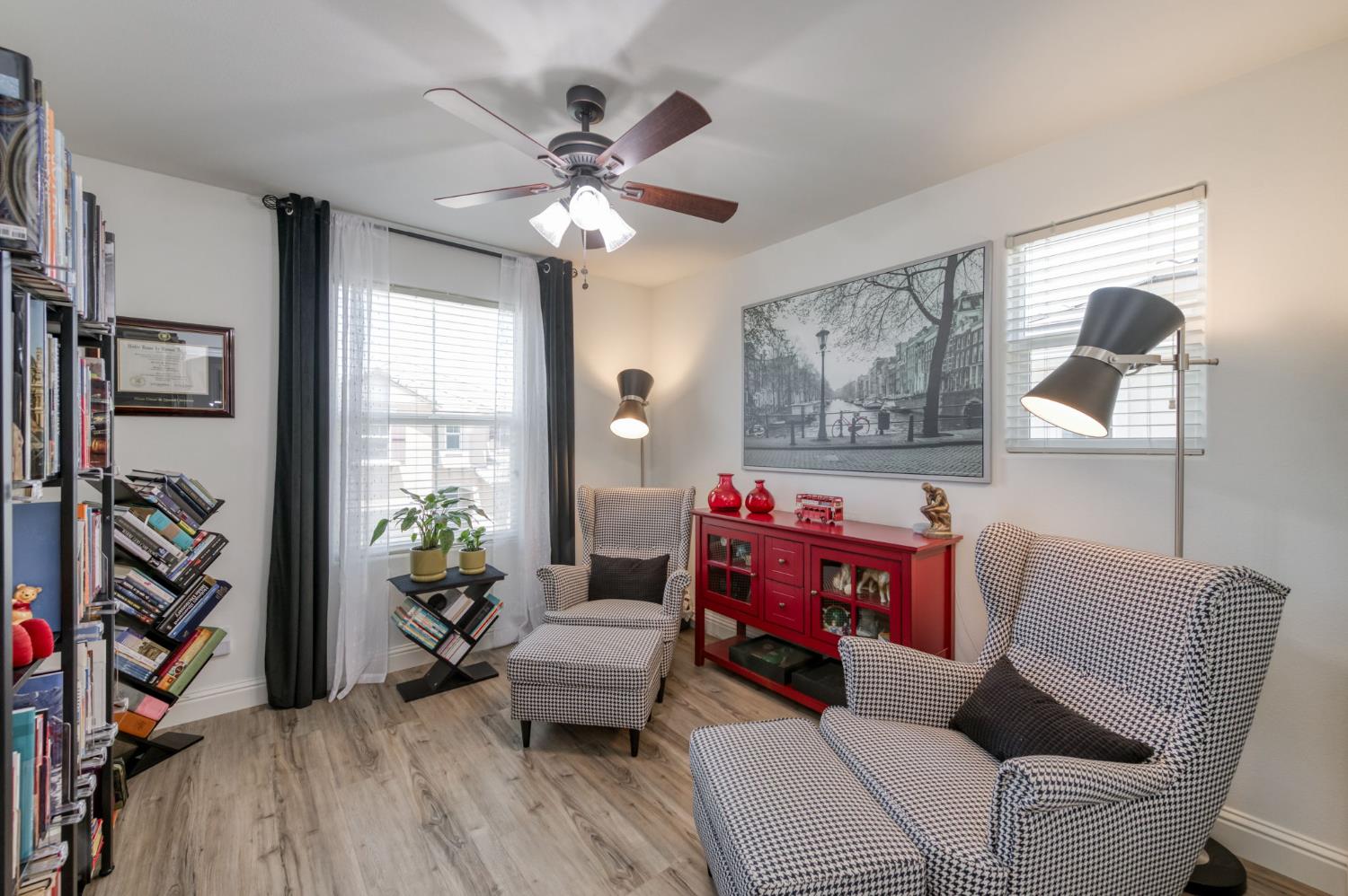 3562 Luminary Way Clovis, CA 93619 - Photo 25 of 40 a living room with furniture a flat screen tv and a window