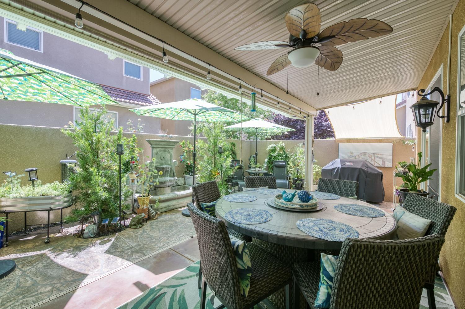 3562 Luminary Way Clovis, CA 93619 - Photo 39 of 40 a view of an outdoor dining space with a table and chairs