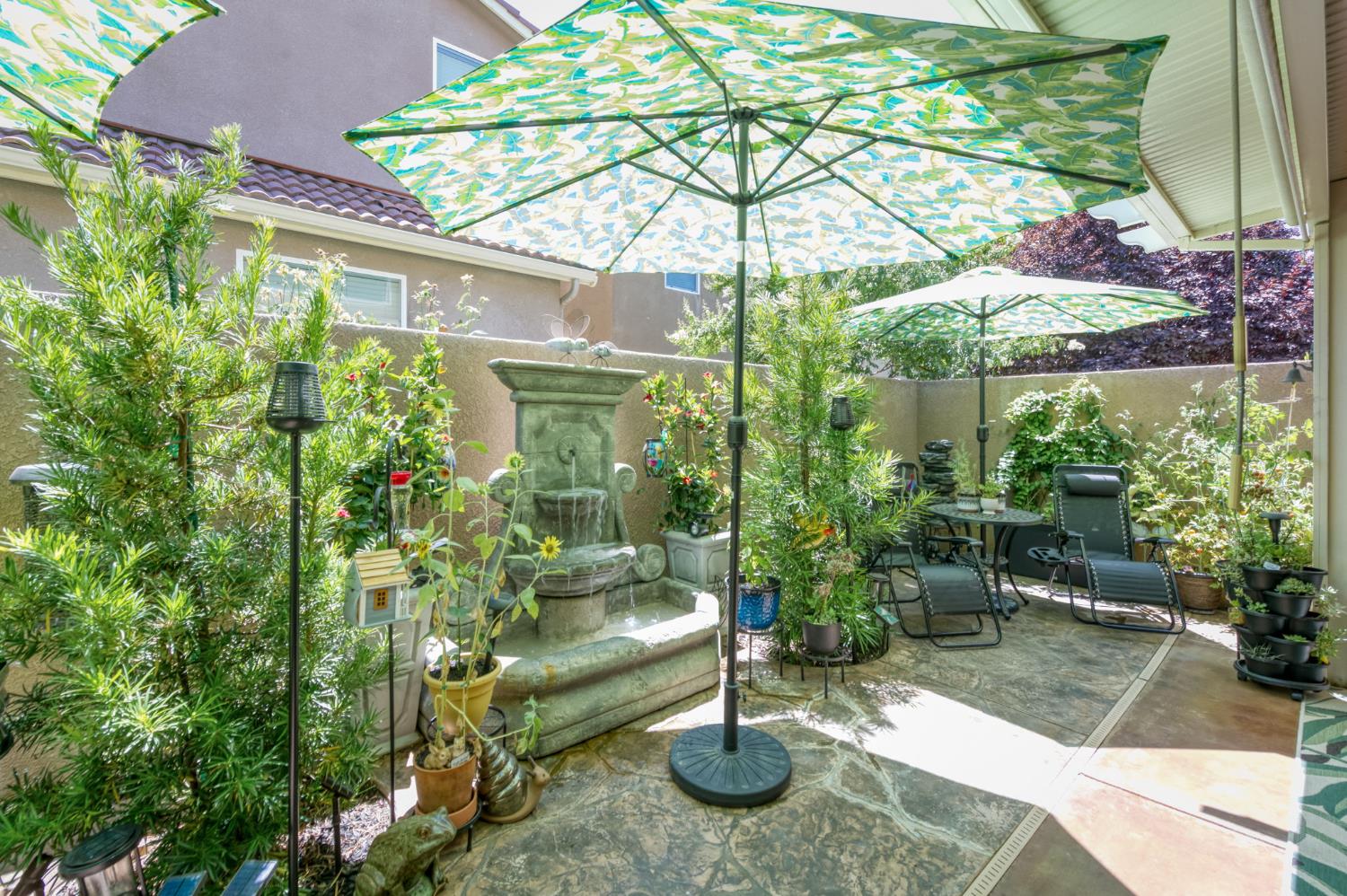 3562 Luminary Way Clovis, CA 93619 - Photo 40 of 40 a backyard of a house with table and chairs