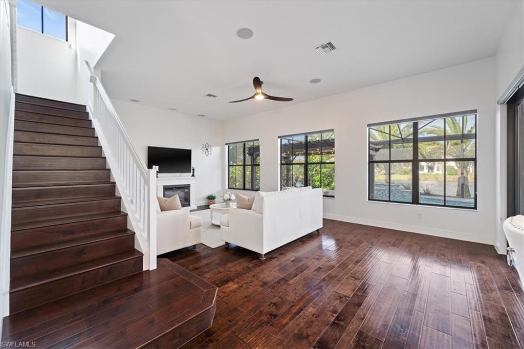 5135 Genoa Street Ave Maria, FL 34142 - Photo 16 of 35 a living room with furniture and wooden floor