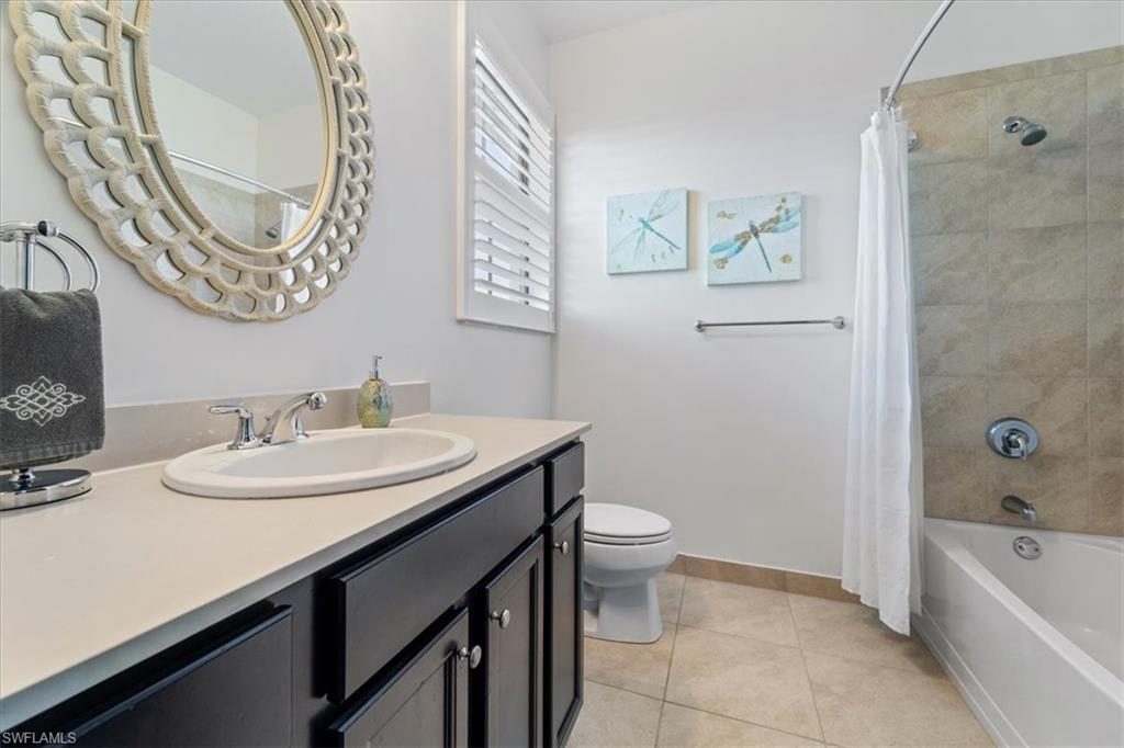 5135 Genoa Street Ave Maria, FL 34142 - Photo 21 of 35 a bathroom with a sink a toilet and a bathtub