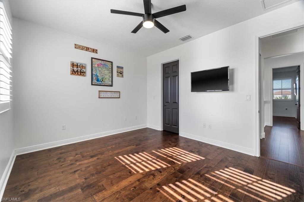 5135 Genoa Street Ave Maria, FL 34142 - Photo 23 of 35 a view of livingroom with hardwood floor and a ceiling fan