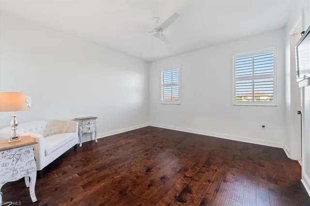 a bedroom with a bed couch and window
