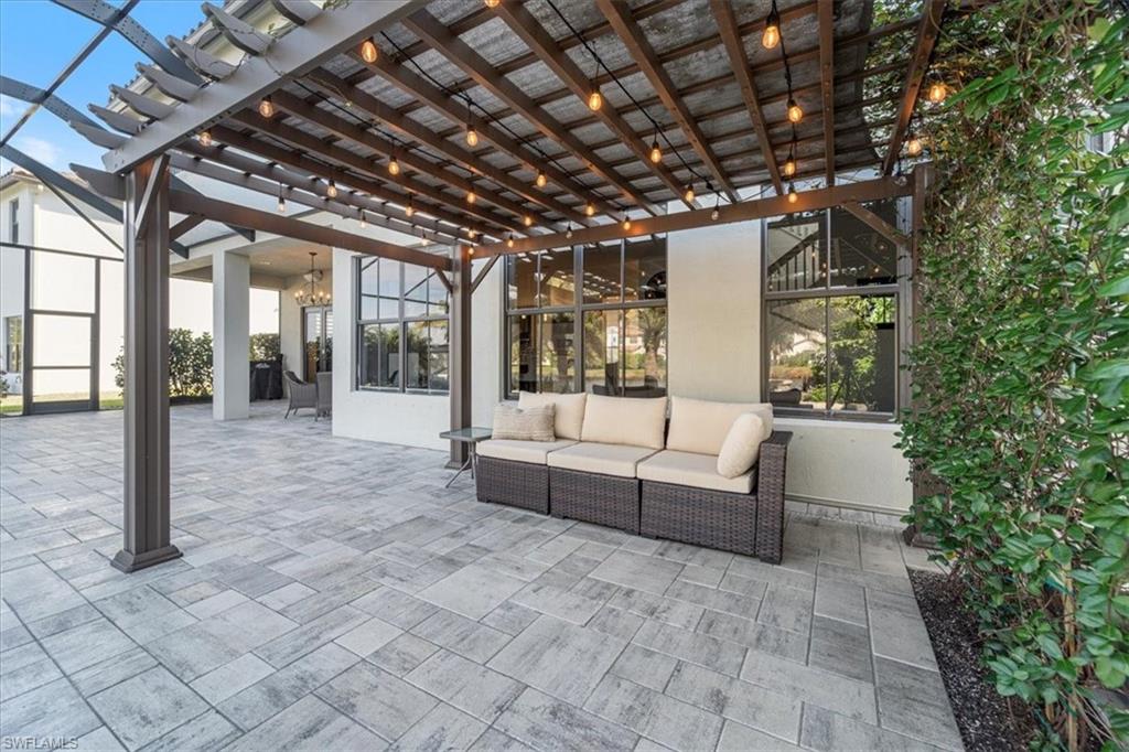 5135 Genoa Street Ave Maria, FL 34142 - Photo 29 of 35 a view of a couches and table in the patio