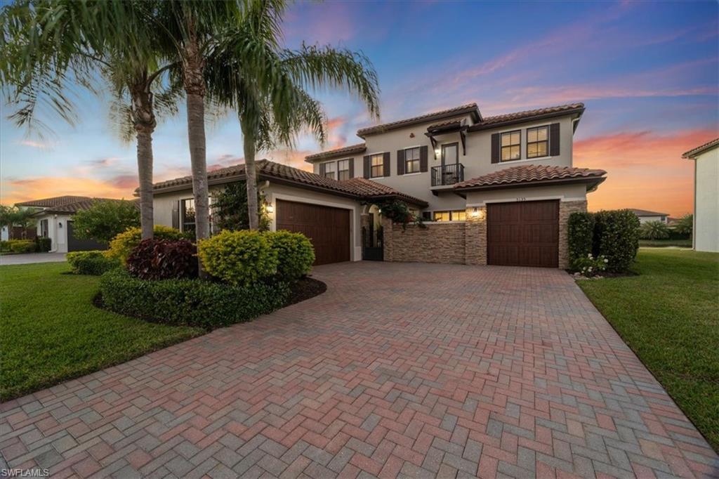 5135 Genoa Street Ave Maria, FL 34142 - Photo 32 of 35 a house view with a garden space