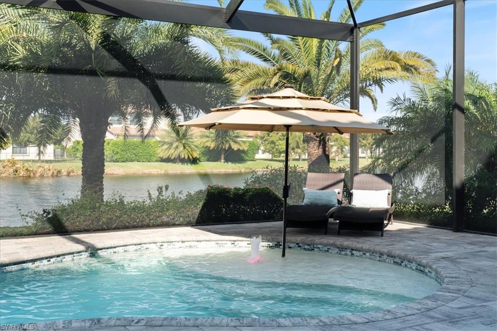 5135 Genoa Street Ave Maria, FL 34142 - Photo 5 of 35 a glass bench sitting in front of a building