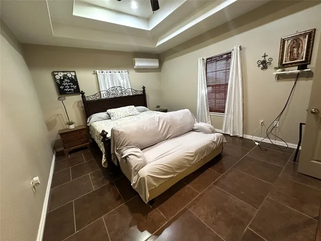 a bathroom with a granite countertop sink a large mirror and a shower
