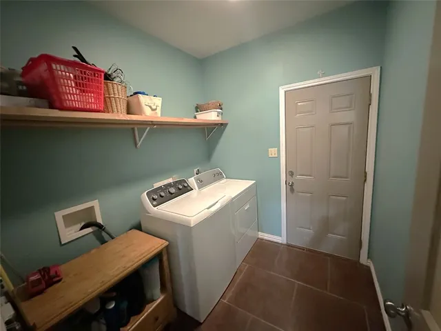a view of a porch with chairs and a patio