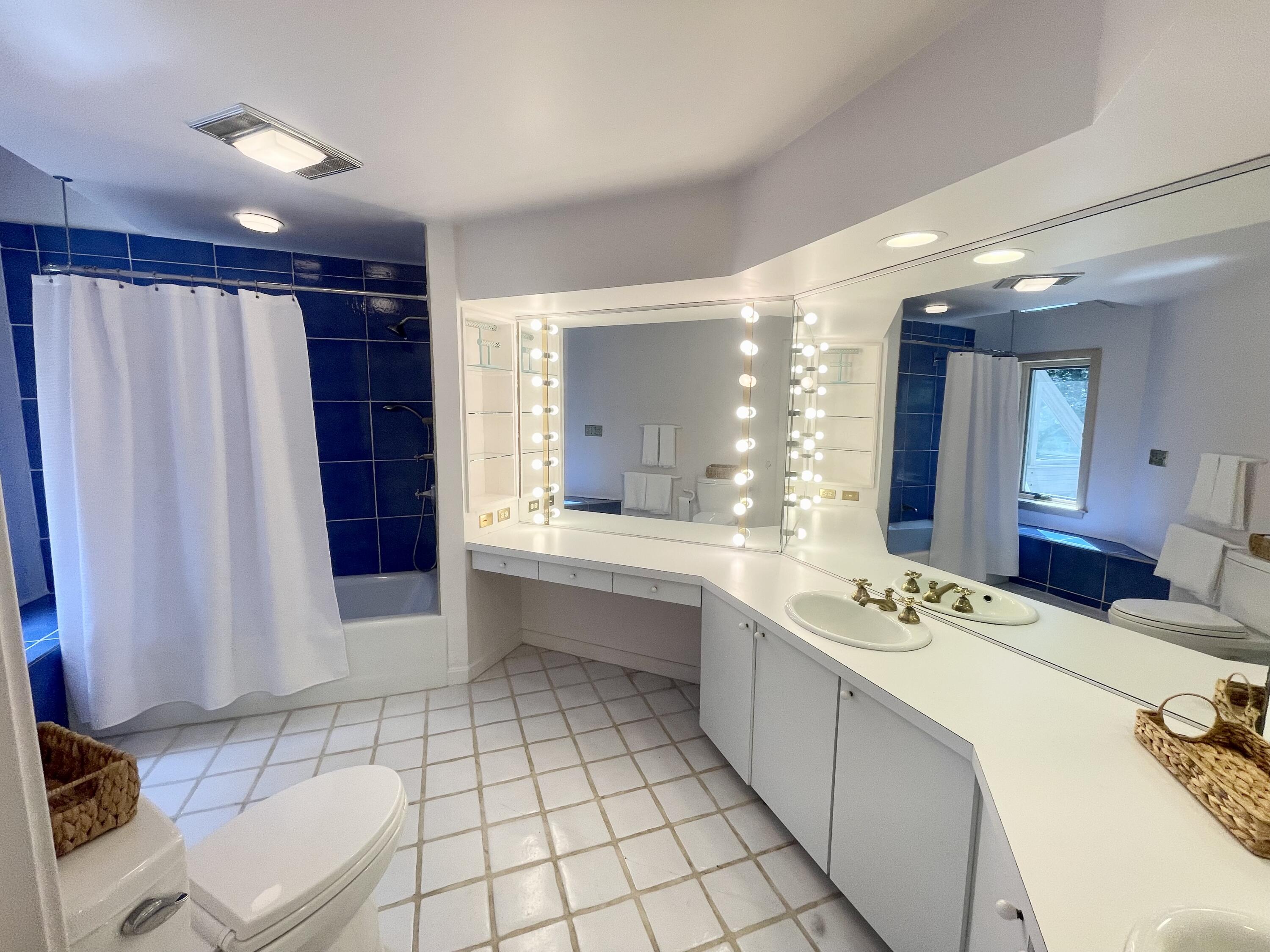 87 Tracey Road Cotuit, MA 02635 - Photo 27 of 33 a large white bathroom with a double vanity sink mirror and bathtub