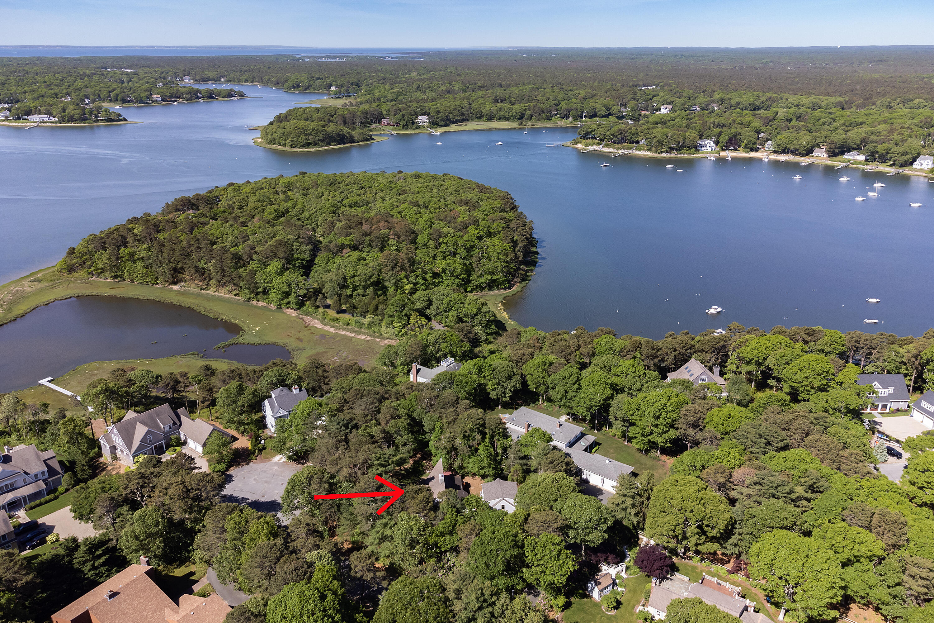 87 Tracey Road Cotuit, MA 02635 - Photo 5 of 33 an aerial view of ocean with residential house and green space