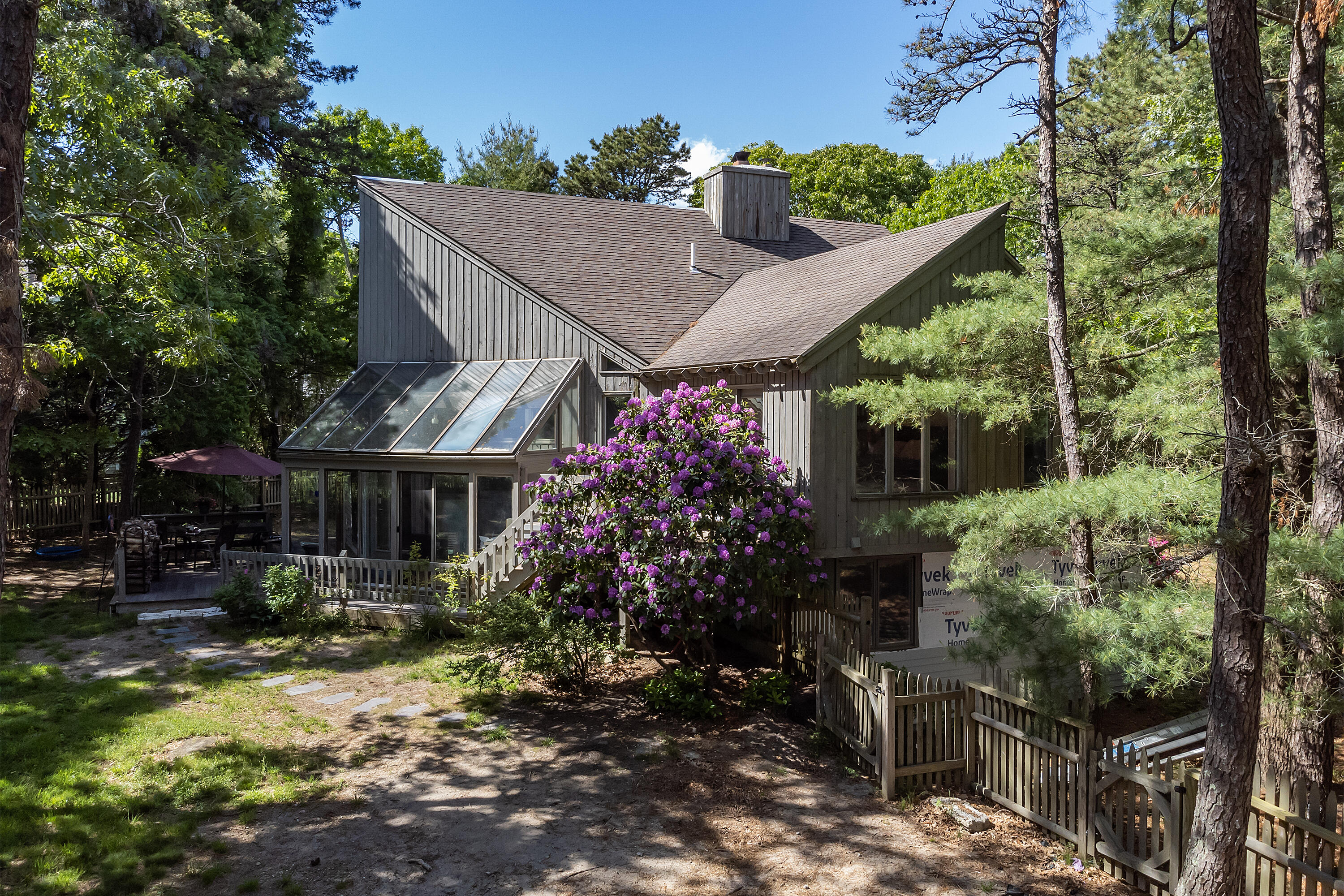 87 Tracey Road Cotuit, MA 02635 - Photo 6 of 33 a view of a house with garden and plants