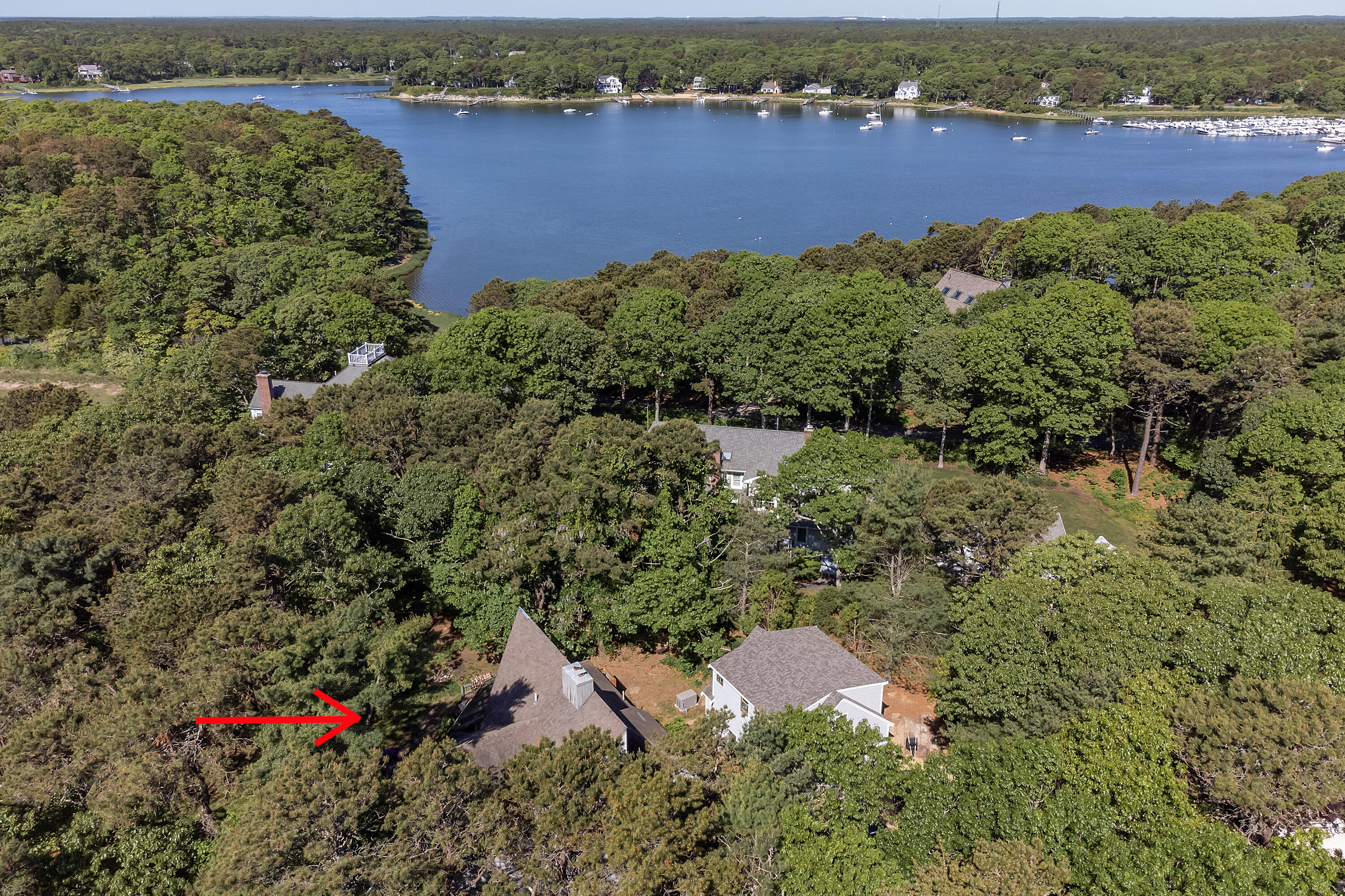 87 Tracey Road Cotuit, MA 02635 - Photo 7 of 33 an aerial view of residential houses with outdoor space and river