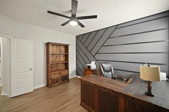 a view of workspace with wooden floor