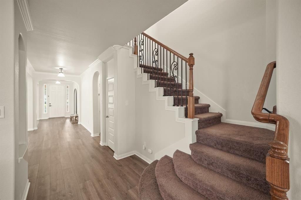 20358 Mathis Landing Drive Cypress, TX 77433 - Photo 17 of 32 a view of entryway and hall with wooden floor
