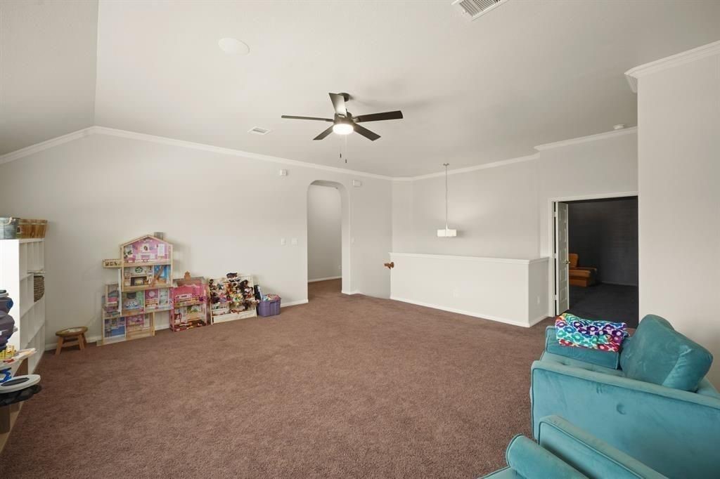 20358 Mathis Landing Drive Cypress, TX 77433 - Photo 18 of 32 a living room with furniture and a flat screen tv
