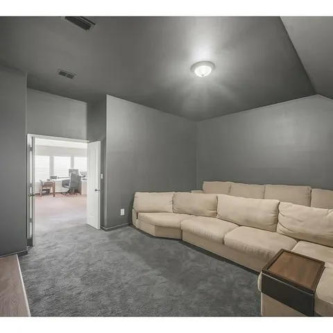 a living room with furniture and a couch