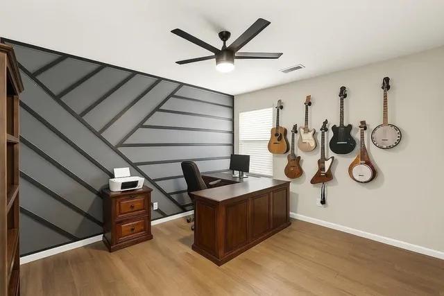 a view of a livingroom with furniture and wooden floor