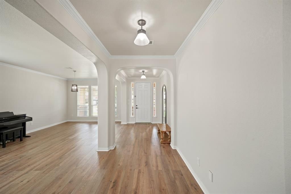 20358 Mathis Landing Drive Cypress, TX 77433 - Photo 9 of 32 wooden floor in an empty room with a window
