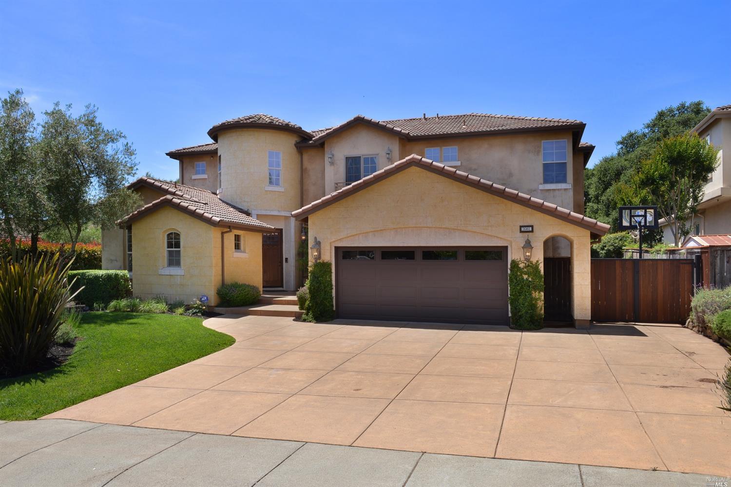 3981 Parker Hill Road Santa Rosa, CA 95404 - Photo 1 of 1 a front view of a house with a yard and garage