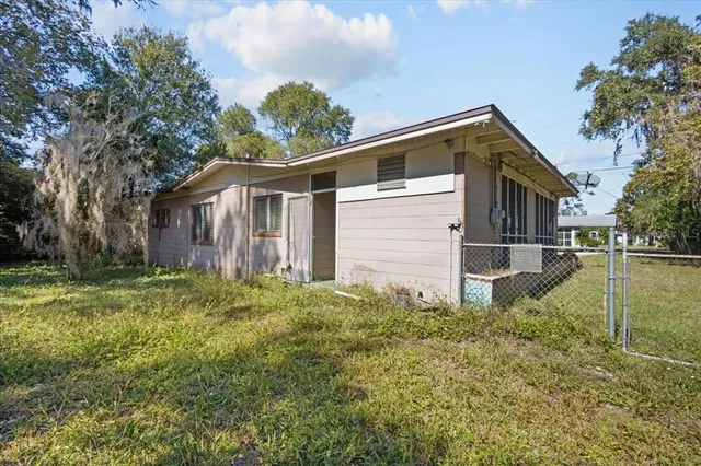 an aerial view of residential house with outdoor space