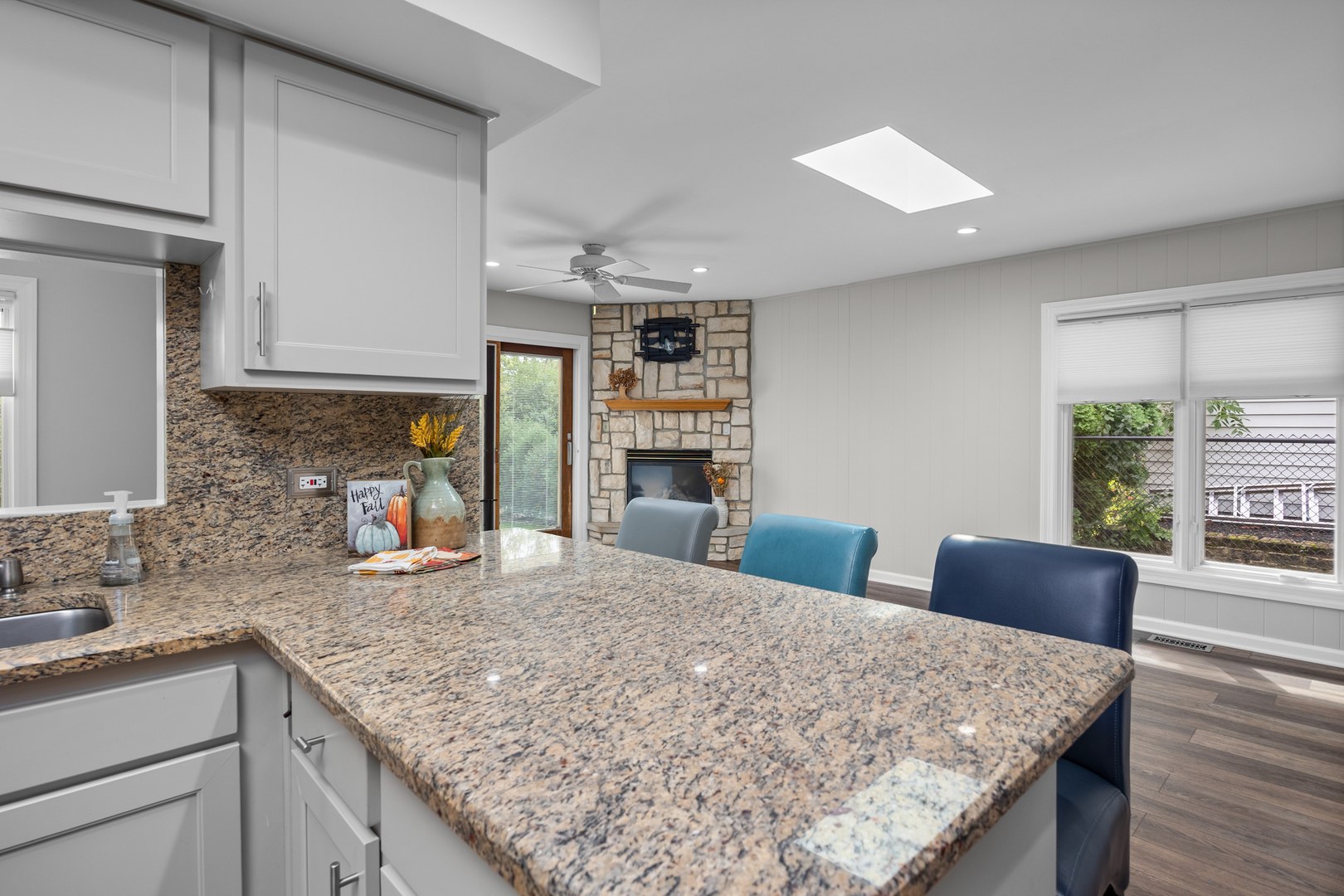 1505 Chartwell Road Hoffman Estates, IL 60169 - Photo 12 of 38 a kitchen with stainless steel appliances granite countertop wooden cabinets a stove top oven a sink and dishwasher