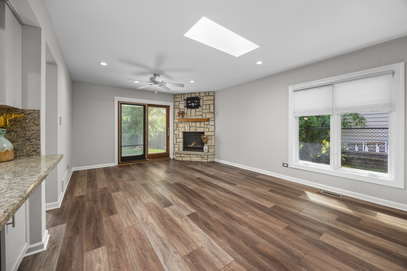 1505 Chartwell Road Hoffman Estates, IL 60169 - Photo 14 of 38 a view of an empty room with a window and wooden floor