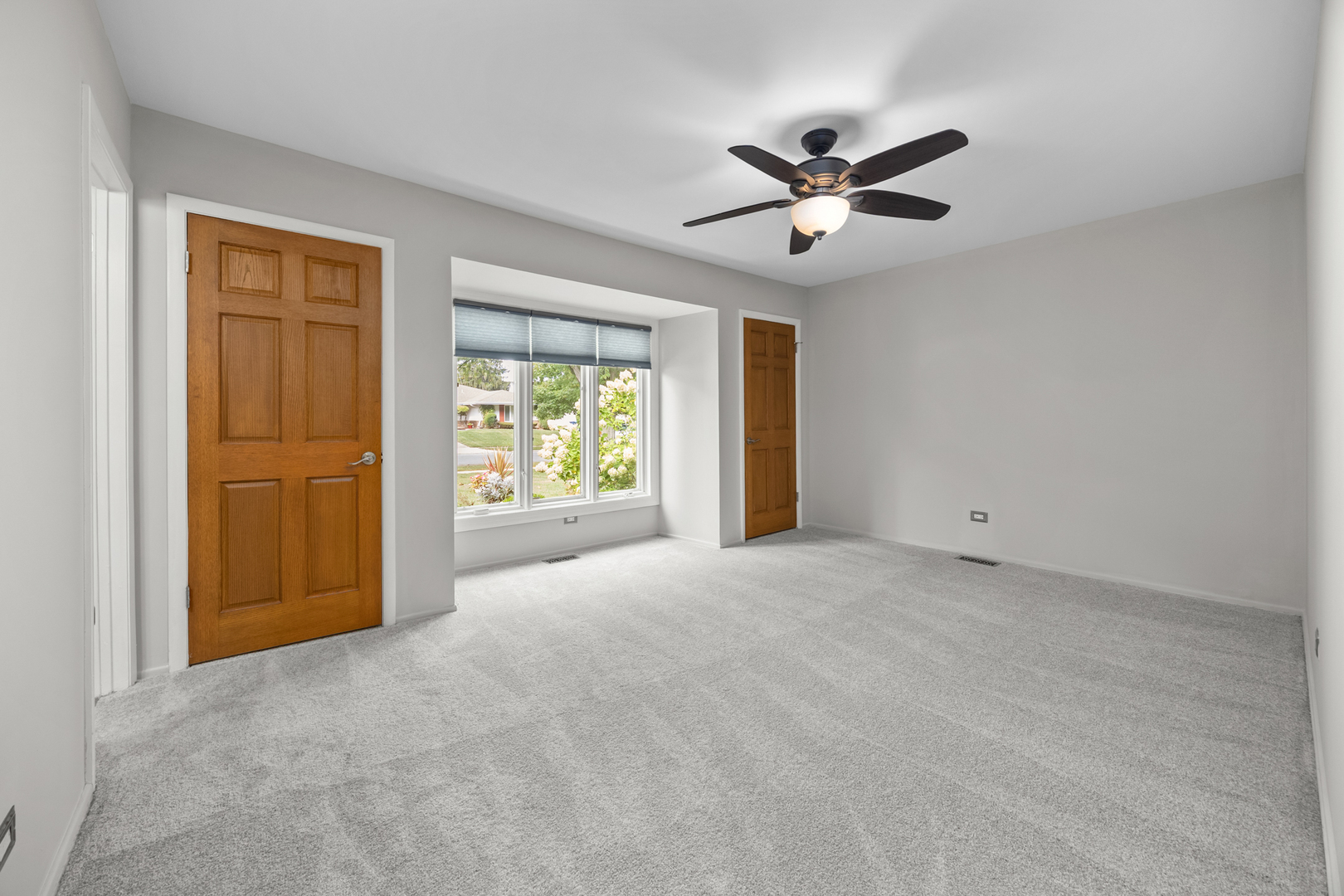 1505 Chartwell Road Hoffman Estates, IL 60169 - Photo 17 of 38 a view of a livingroom with a ceiling fan and window