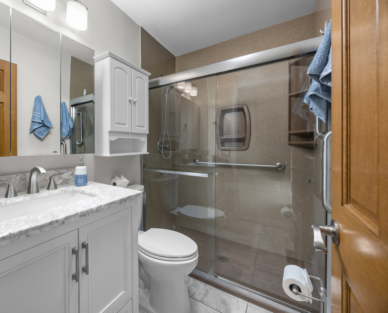1505 Chartwell Road Hoffman Estates, IL 60169 - Photo 19 of 38 a bathroom with a granite countertop sink toilet and shower