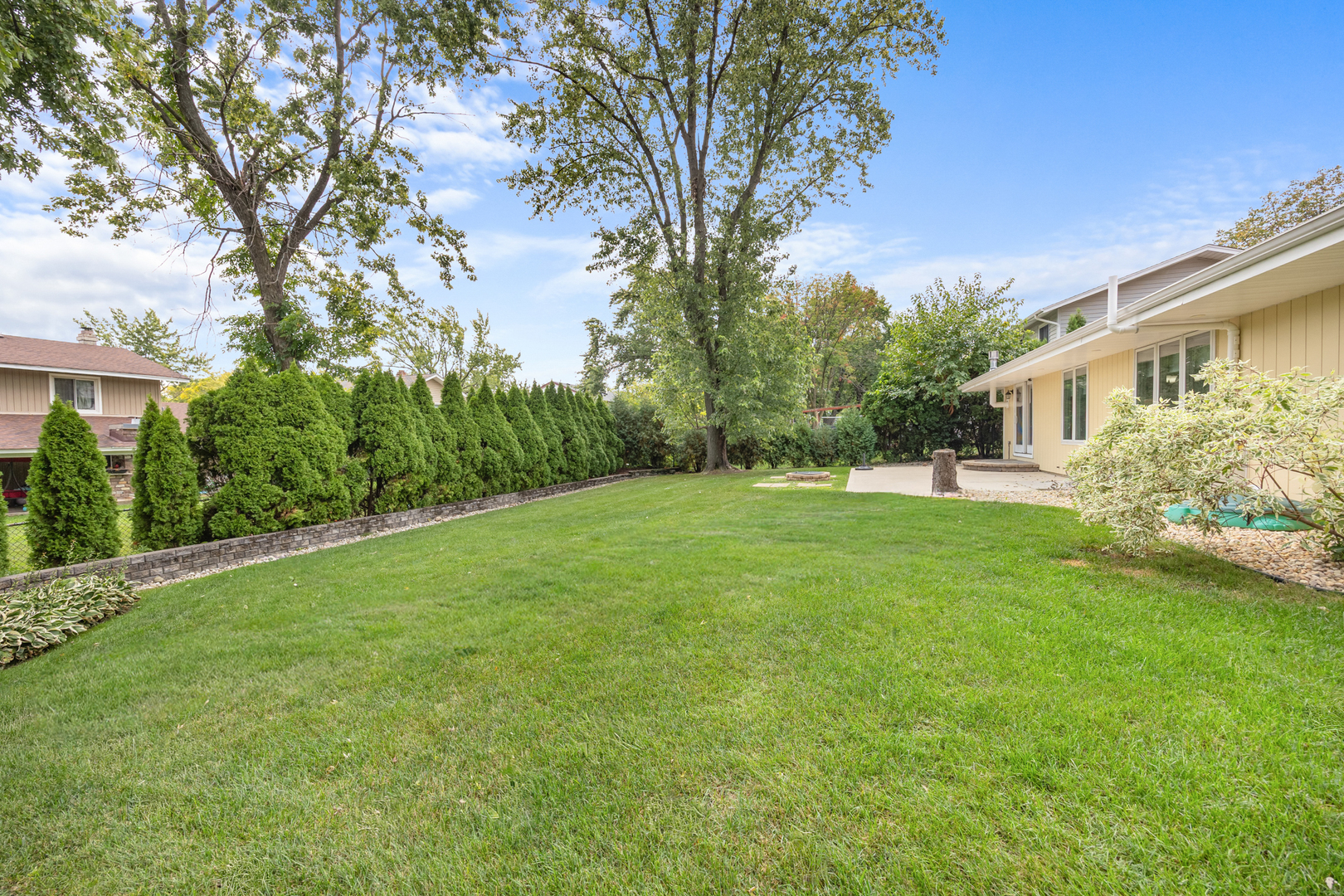 1505 Chartwell Road Hoffman Estates, IL 60169 - Photo 31 of 38 a view of house with yard and trees in the background