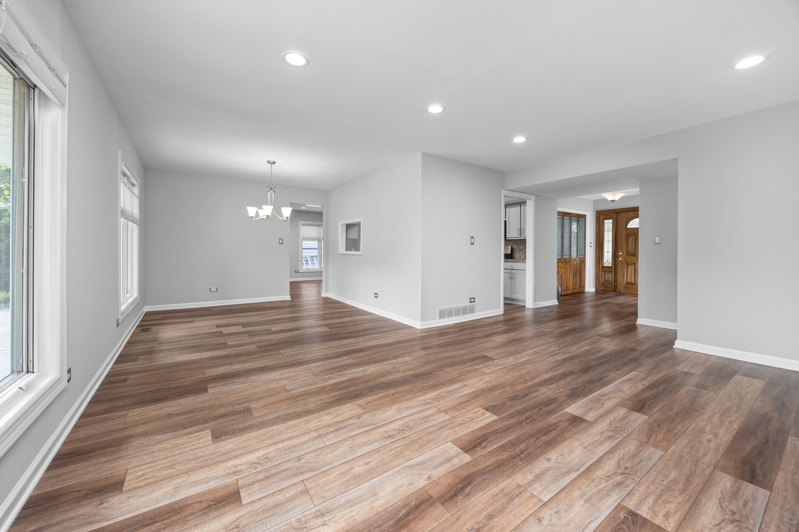 1505 Chartwell Road Hoffman Estates, IL 60169 - Photo 8 of 38 a view of empty room with wooden floor and fan