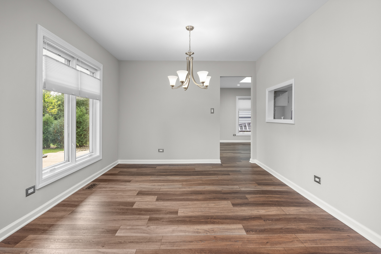 1505 Chartwell Road Hoffman Estates, IL 60169 - Photo 9 of 38 a view of a room with wooden floor and window