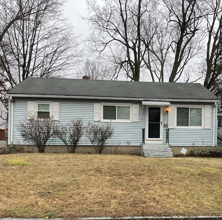 31 Alice Street Springfield, MA 01109 - Photo 1 of 10 a front view of house with yard and trees around