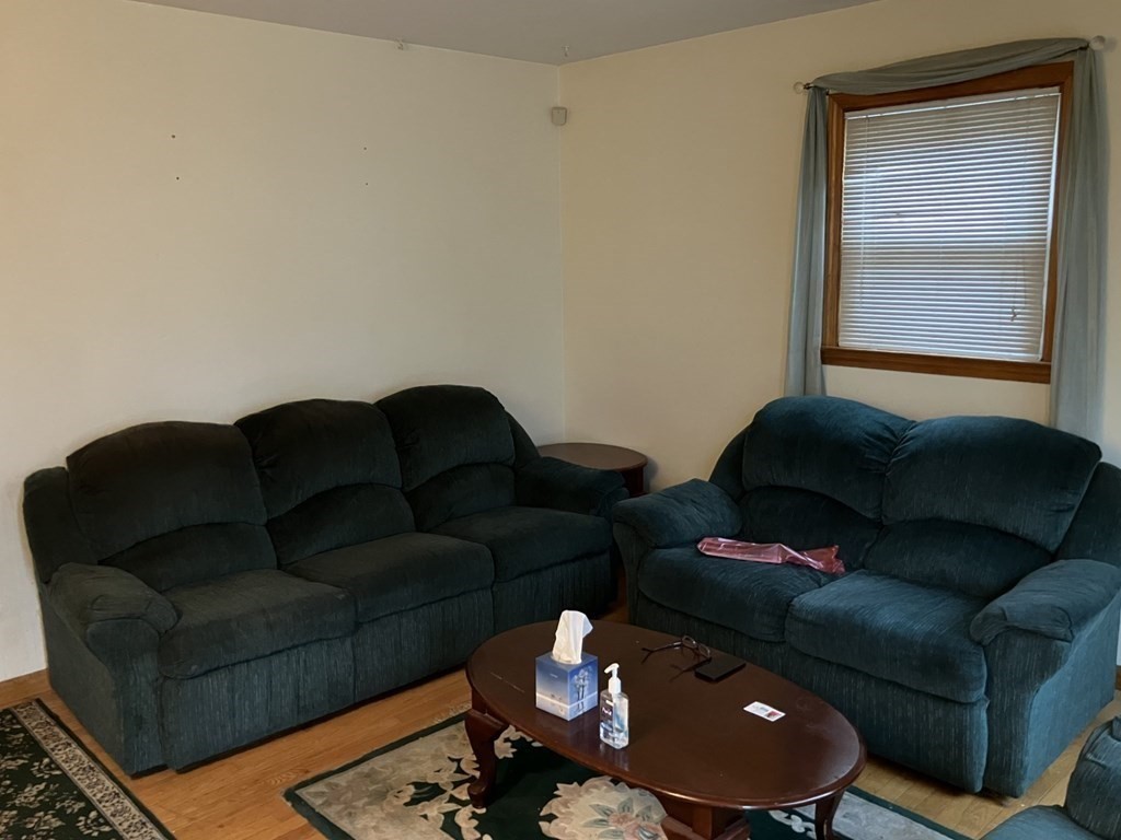 31 Alice Street Springfield, MA 01109 - Photo 3 of 10 a living room with furniture and a lamp
