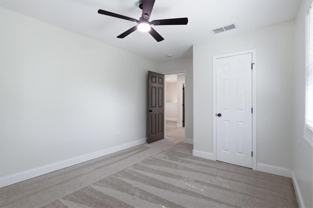 4911 Lower Jersey Road Oxford, GA 30054 - Photo 27 of 56 a view of empty room with wooden floor