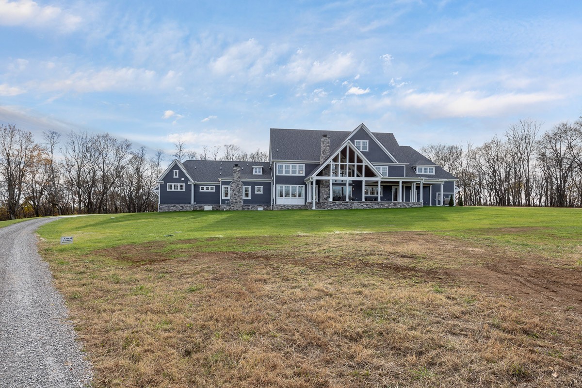 6876 Cross Keys Road College Grove, TN 37046 - Photo 37 of 58 a view of a house with a big yard and large trees