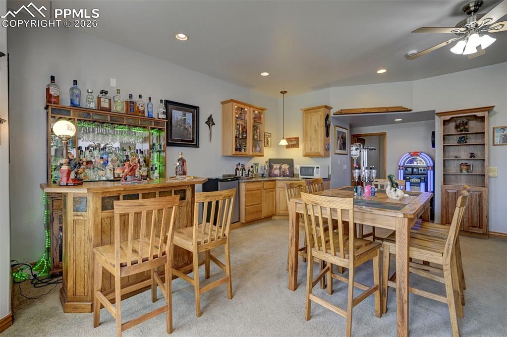 5910 McCart Ranch Circle Elizabeth, CO 80107 - Photo 27 of 50 a view of a dining room with furniture and chandelier